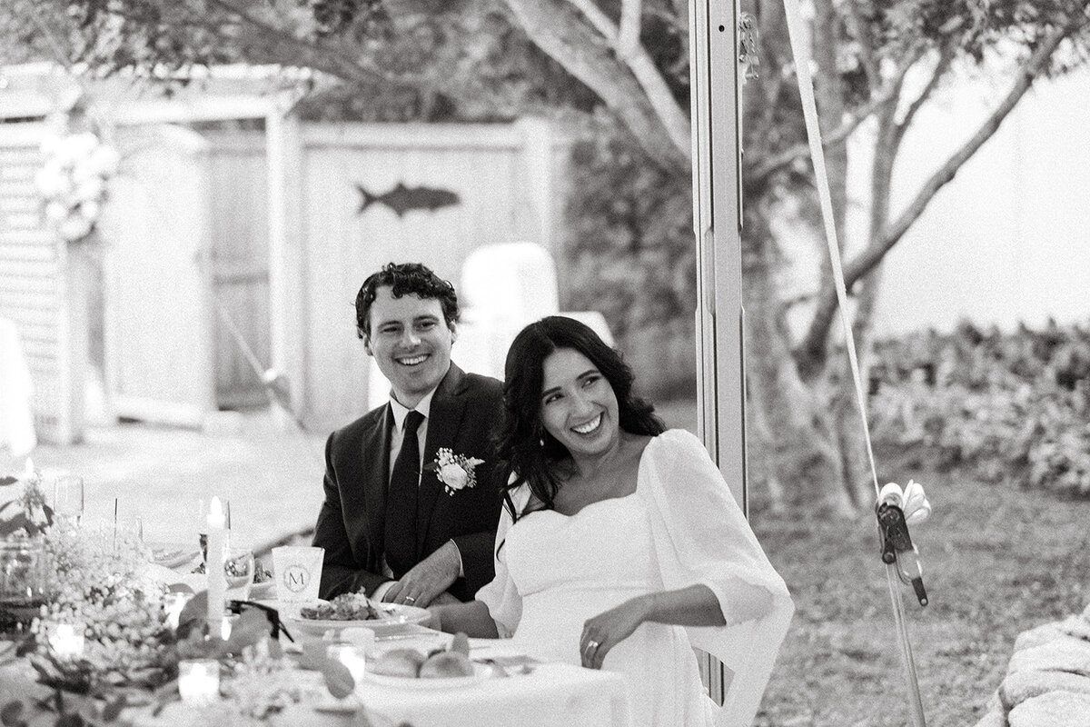 Bride and groom laughing at backyard Cape Cod wedding in Harwichport