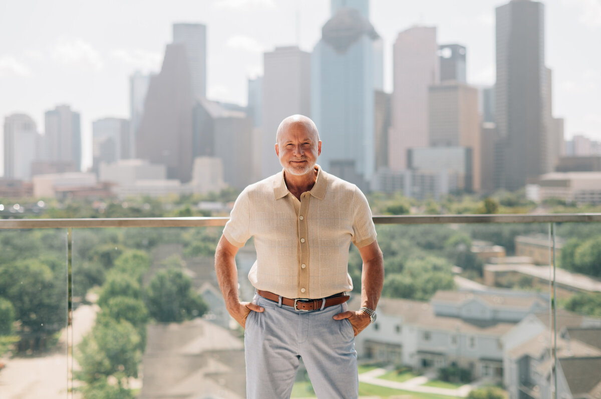Relaxed urban portrait on rooftop by Houston TX business branding photographer