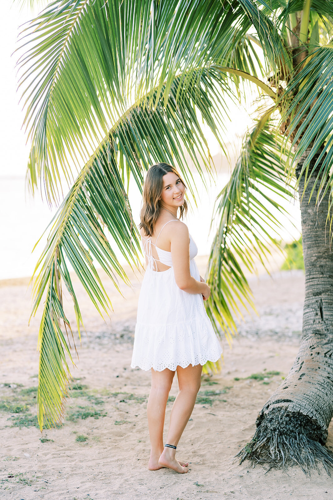 High school senior in a white dress for her portraits