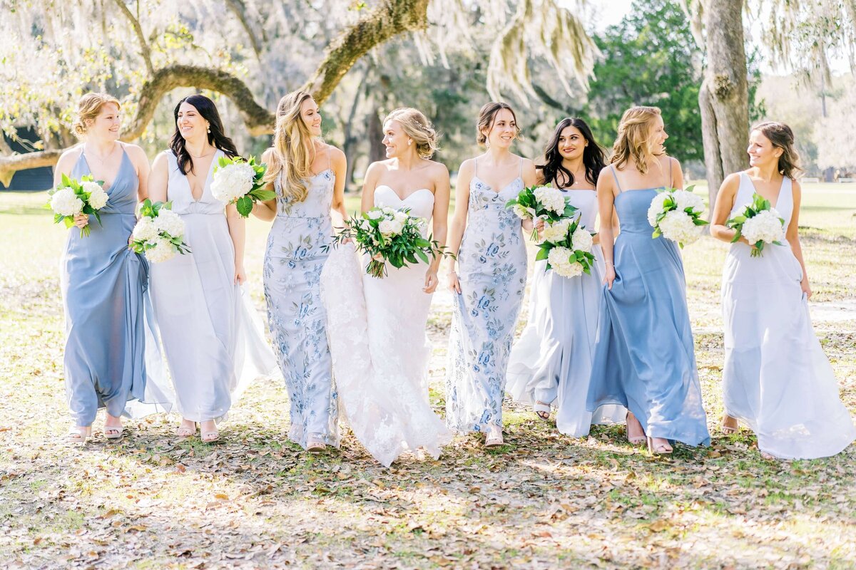 bridesmaids walking in french blue dresses