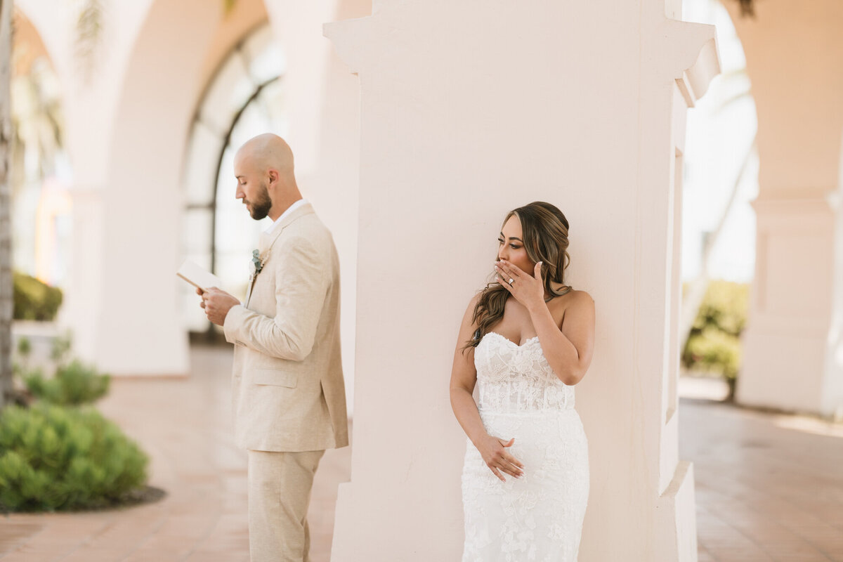 Bride wiping tear during private vows at Hilton Beachfront Resort Santa Barbara