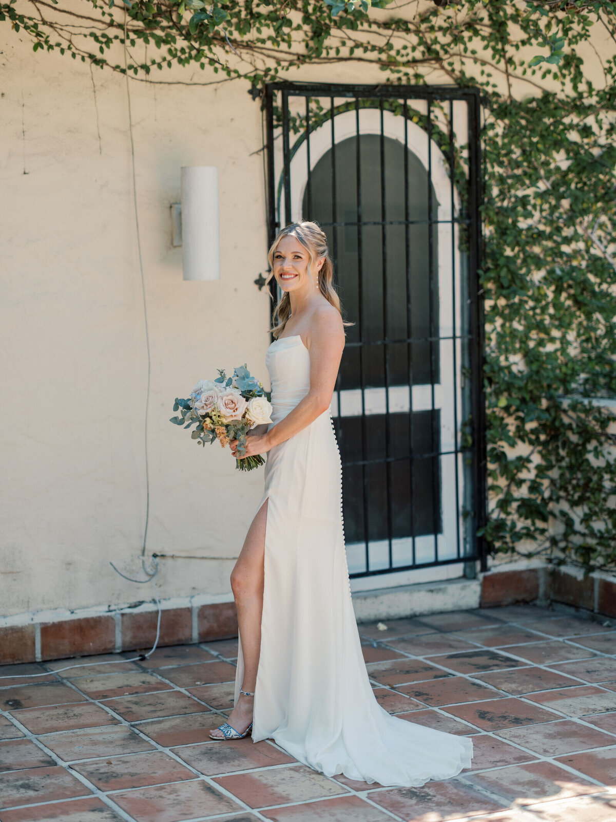 bride-poses-bouquet-7HM-W