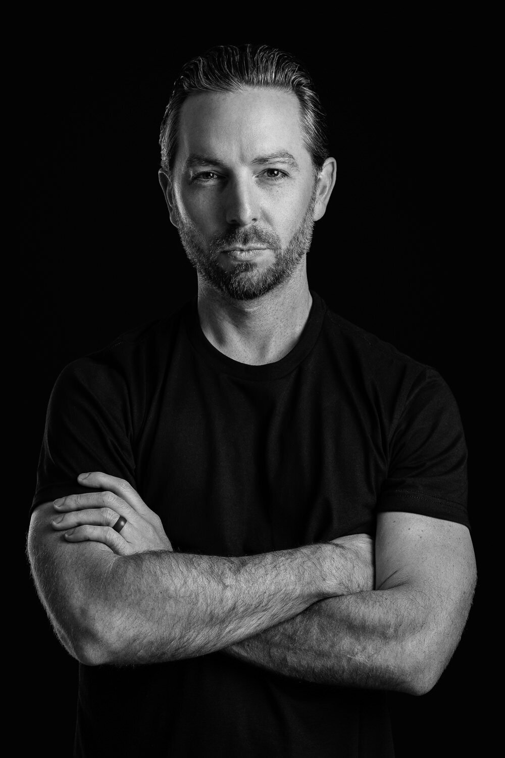 Modern headshot captured in-studio with black backdrop by Austin portrait photographer.