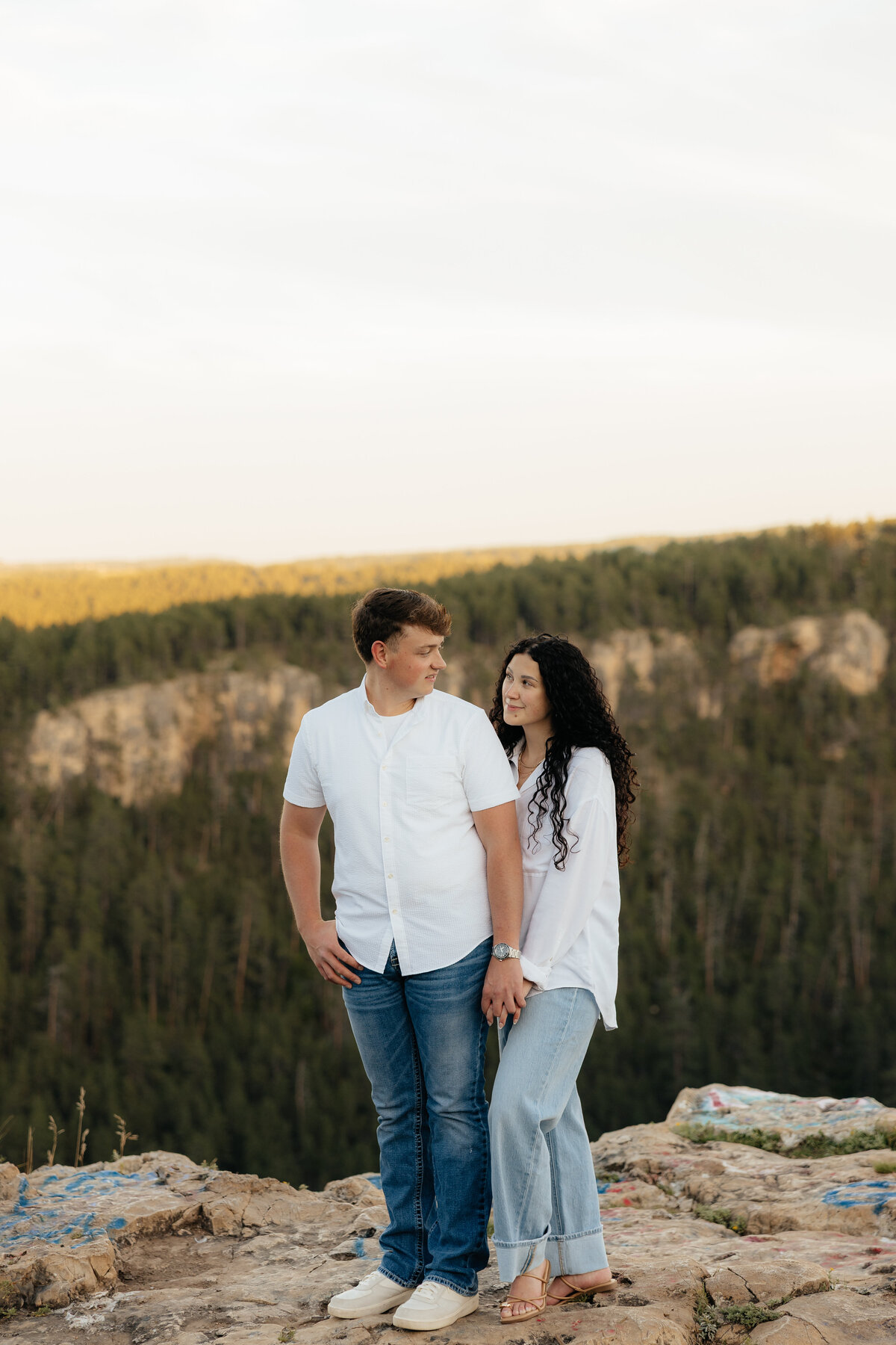 A couple smiling at each other at Falling Rock in Rapid City.