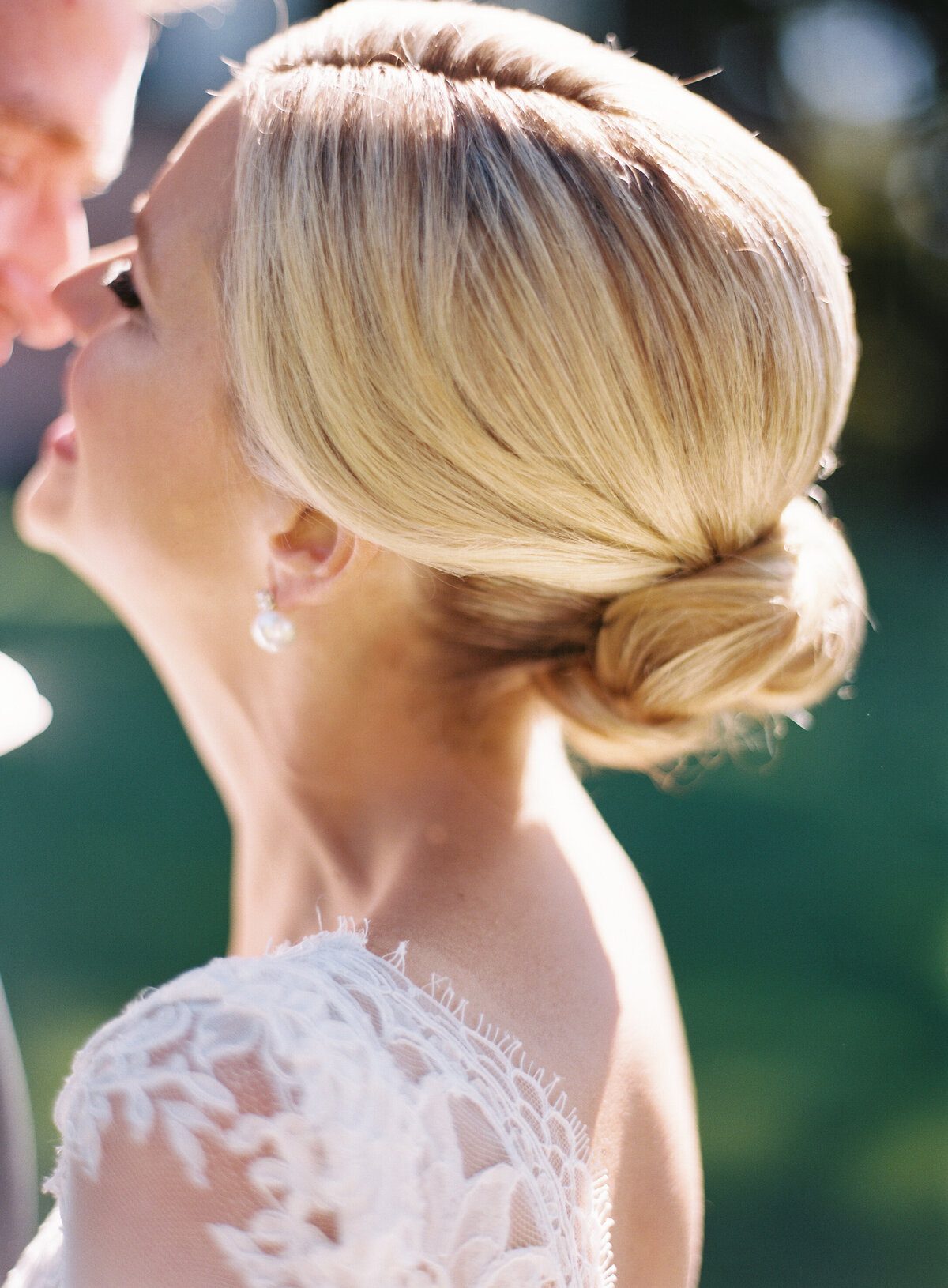 Close up the bride kissing the groom. 