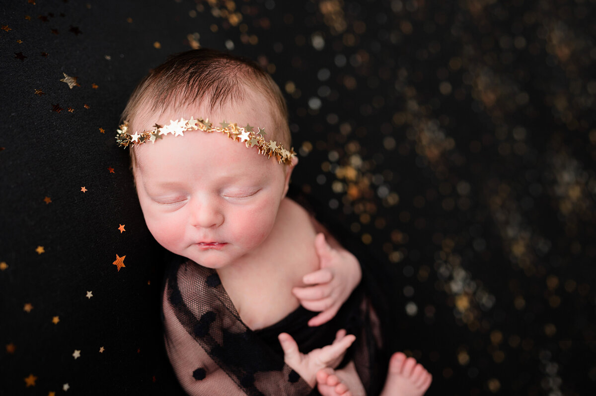 baby girl with creative styling newborn studio session