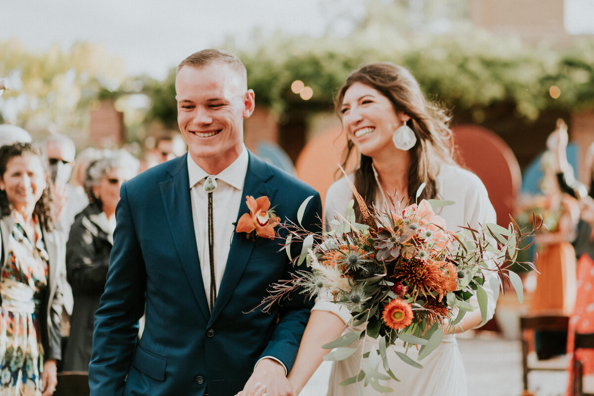 Bride and groom walk down the aisle after their wedding ceremony in NM.