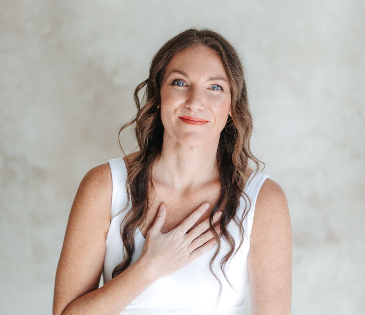 elizabeth smiling with hand on heart