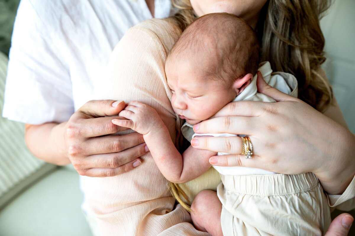 newborn snuggling on moms chest