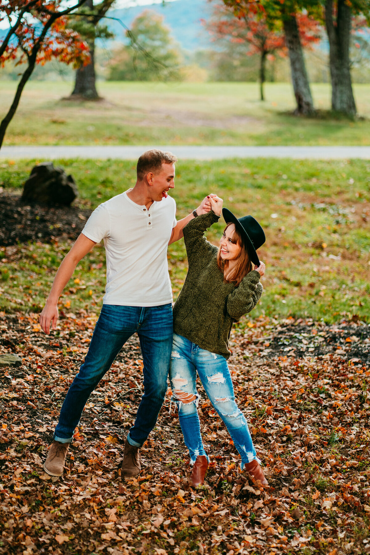  Couple dancing in fallen autumn leaves