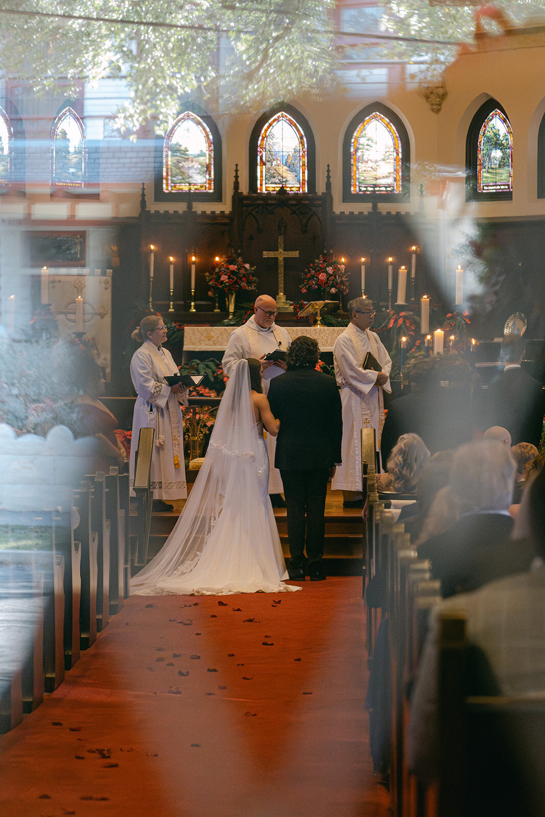 Bride captured walking toward altar in a grand cathedral wedding venue in San Antonio