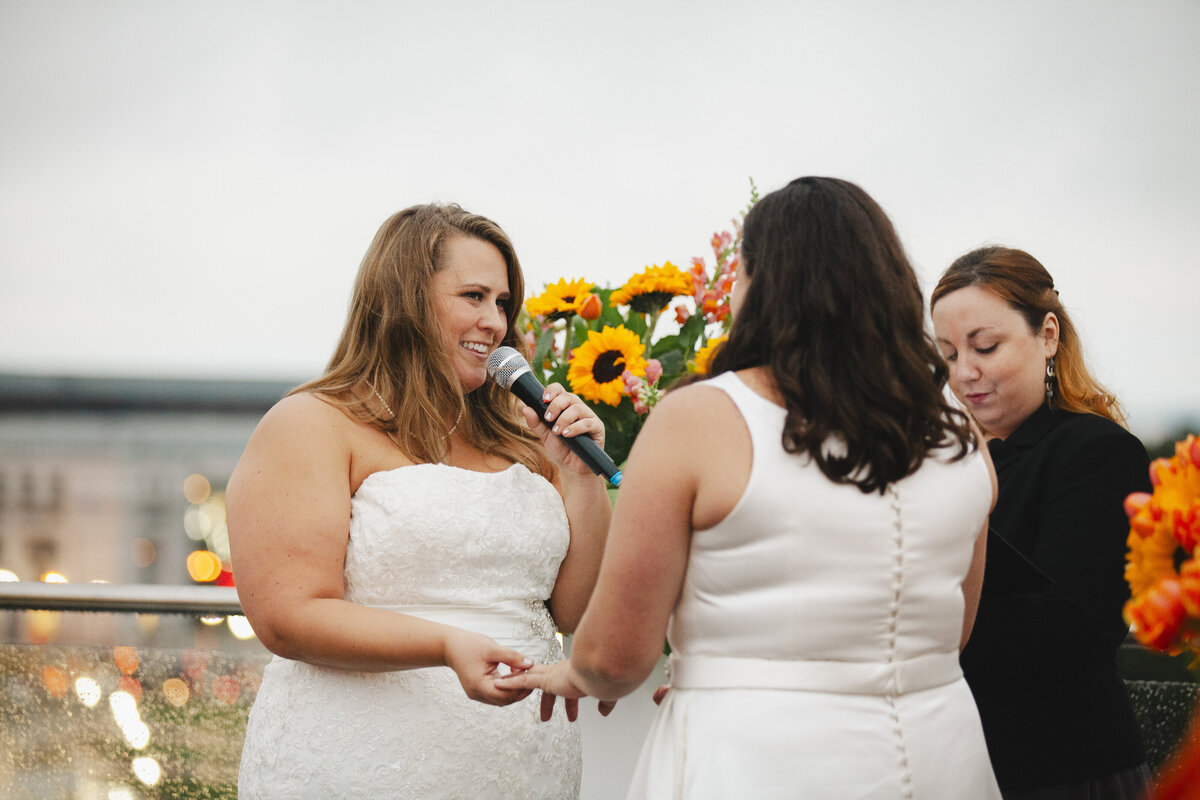 A person saying their vows to their partner during their wedding 