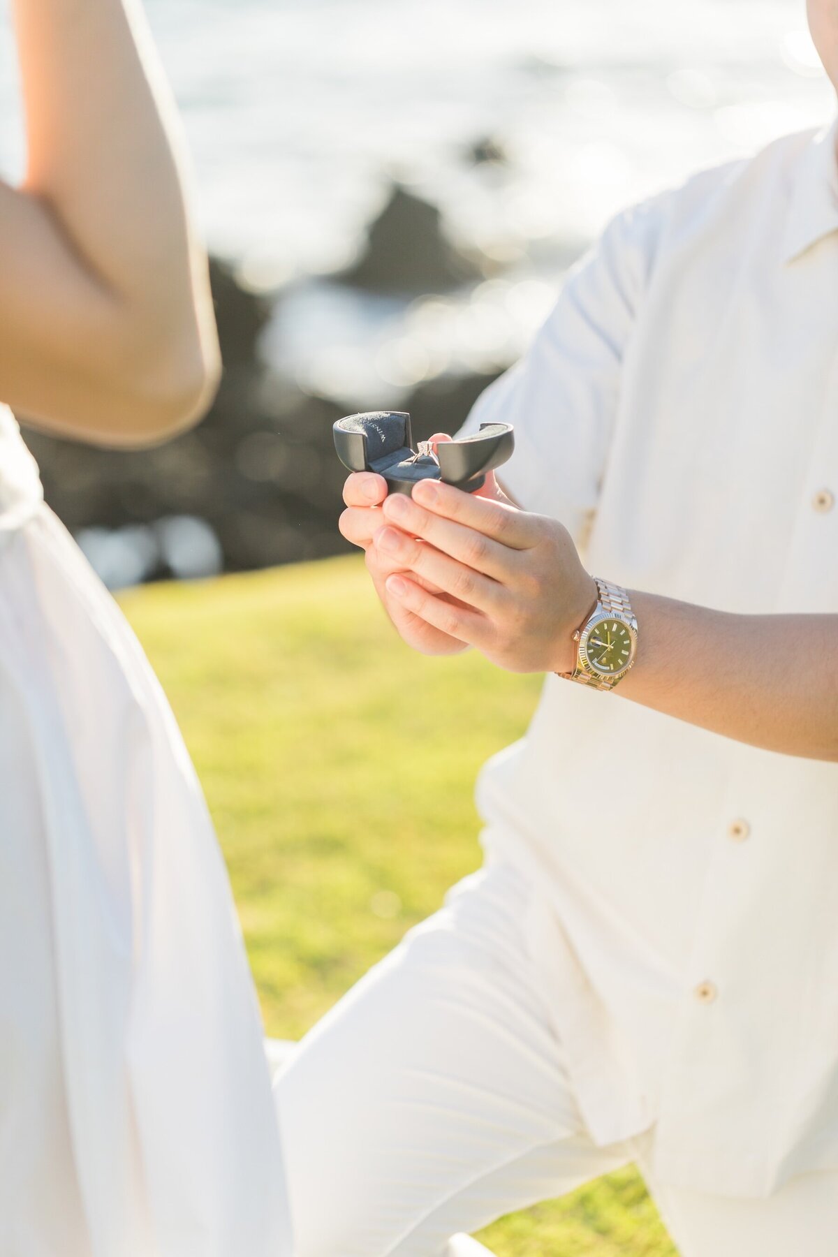 Close-up of engagement ring on Big Island beach in Hawaii
