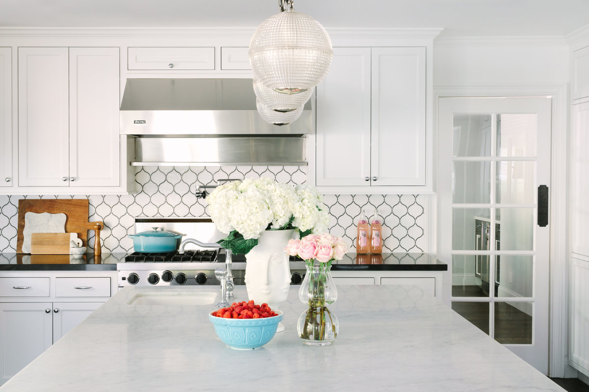 Kitchen with trellis backsplash and Carrara marble countertop