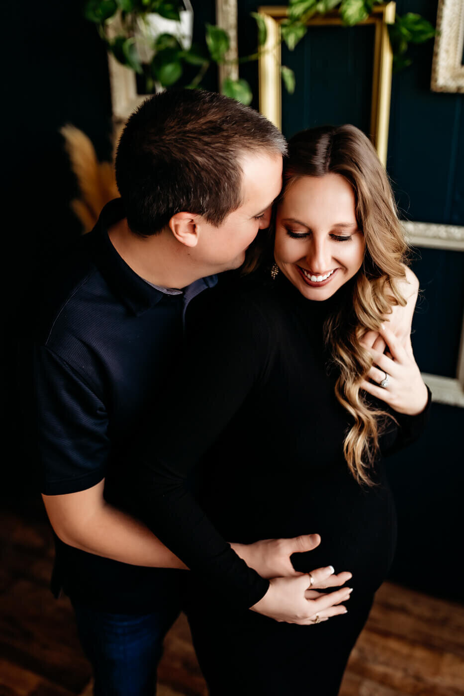 Maternity session with couples hugging