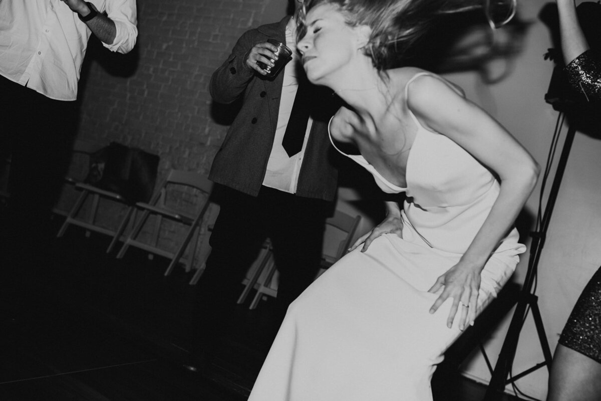 Wedding Photography, Bride dancing around at reception