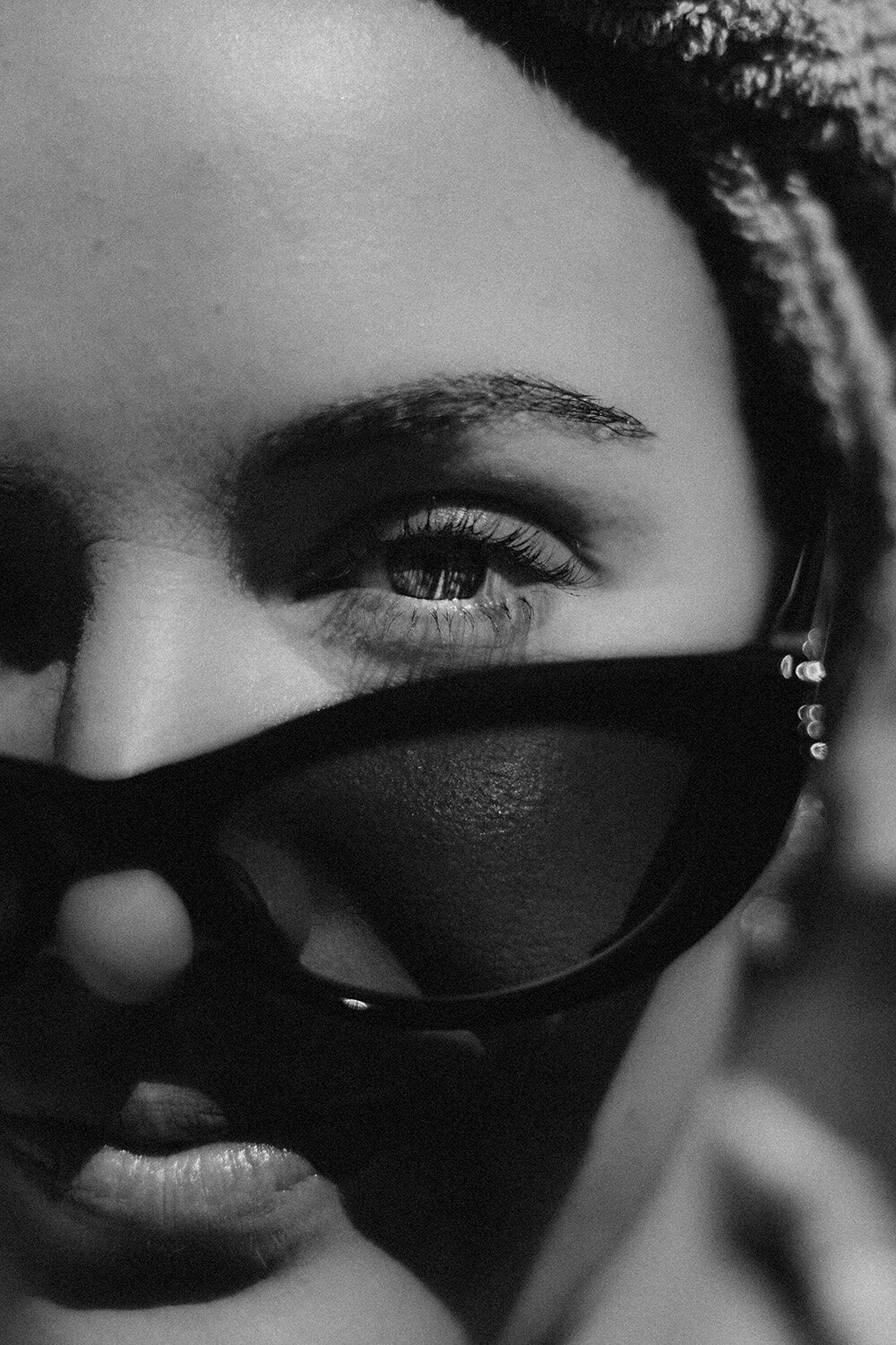 Edgy black-and-white close-up of a woman in dark sunglasses, captured with intention by a Sunshine Coast branding photographer.