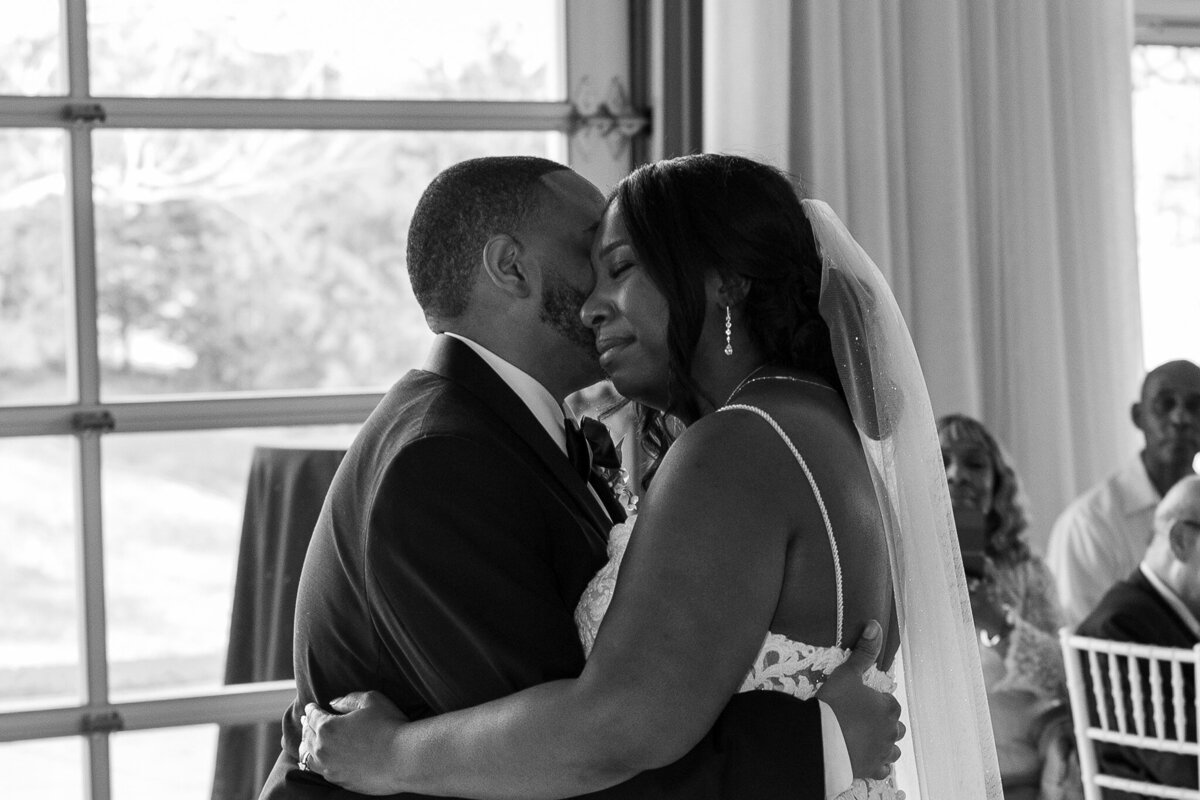 bride and groom at cold springs sharing a heartfelt moment during their first dance