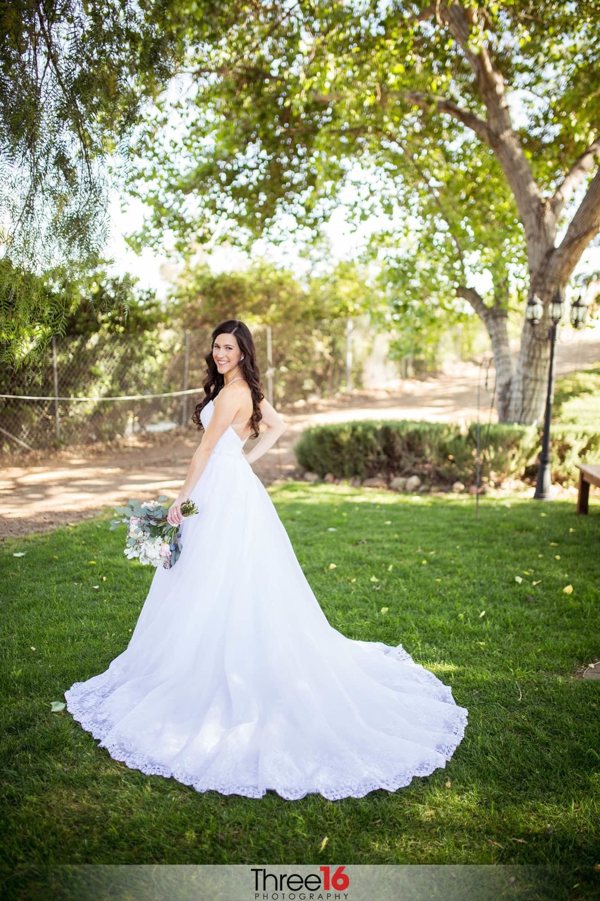 Beautiful Bride posing in her amazing wedding gown