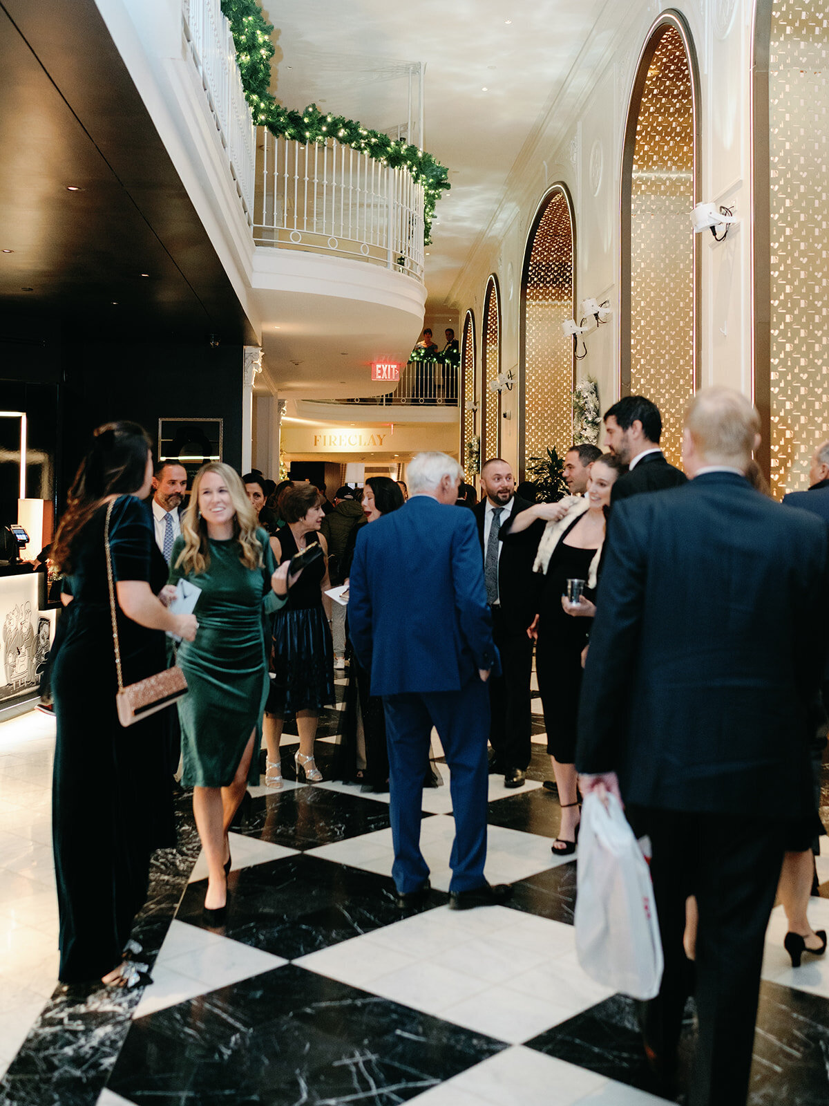 Guests walk toward wedding reception at Hotel Washington 