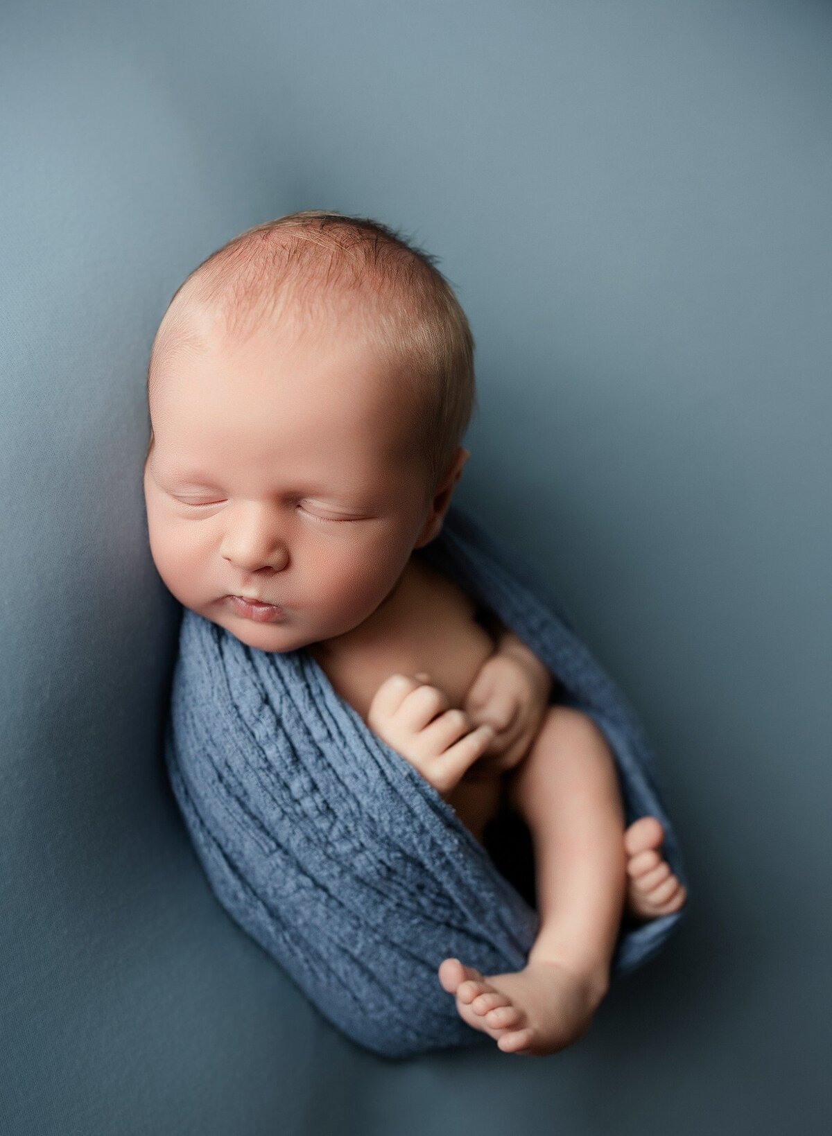baby-boy-sleeping-in-blue-Little-Elm