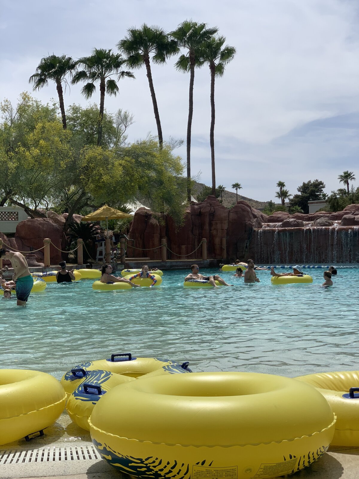 families floating in a lagoon at a resort