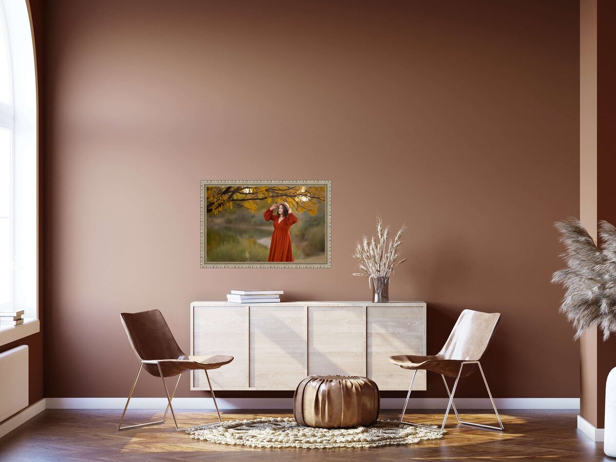 picture of a senior girl hanging on a wall above a side table and chairs in a  home