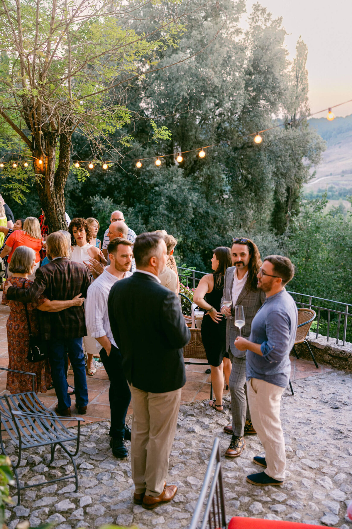 A wedding photo of the venue Laticastelli during cocktail hour in aTuscany Italy