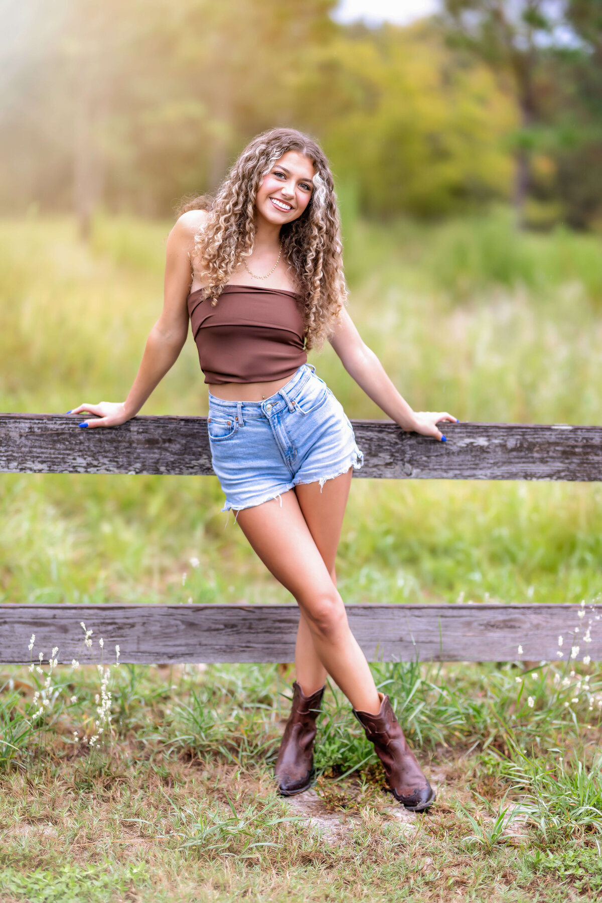 Orlando senior photographer captures golden hour magic with a teen girl in soft natural light.