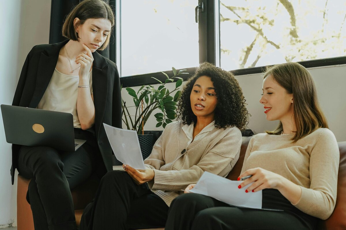 Women leading each other in supportive way.