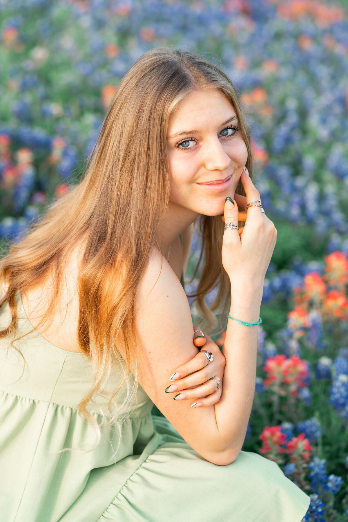 Austin Texas Senior girl with dress in the wildflowers for senior photos. 
