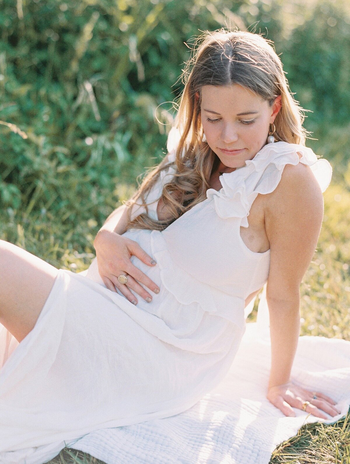 film-photograph-of-expecting-mom-in-white-dress