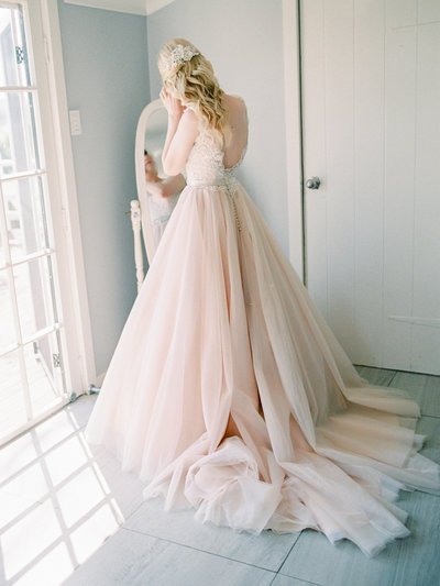 Bride in blush dress Albert River wines