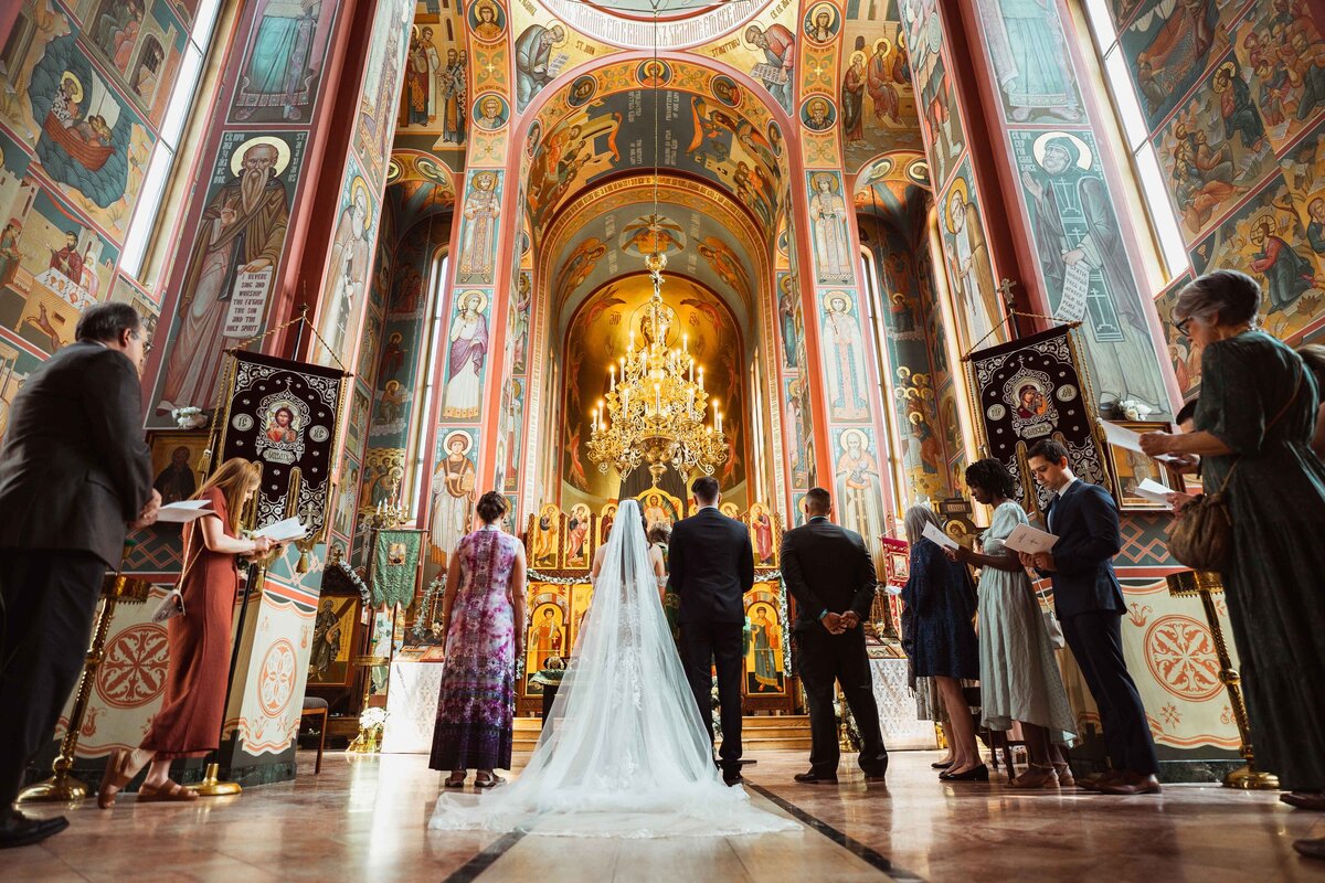 wedding party's back at a wedding ceremony russian orthodox church in washington d.c.