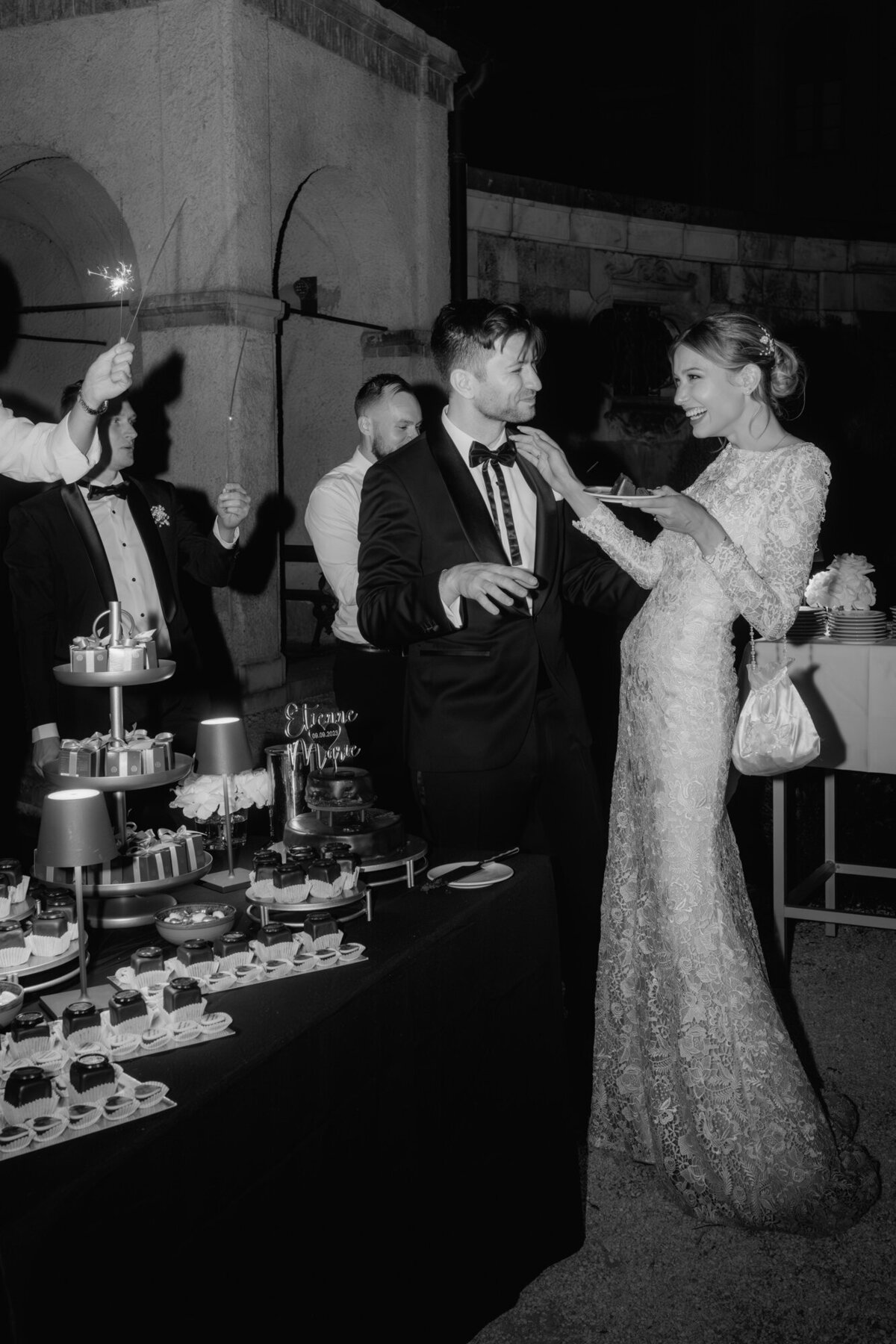 Wedding couple enjoyes sweet buffet, laughing - candid wedding photography.
