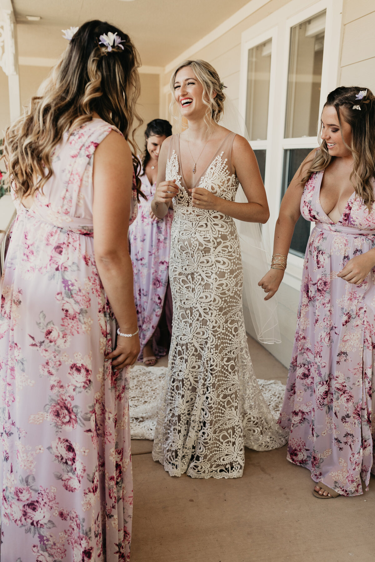 Maralyn-Estate-Garden-Atascadero-CA-wedding-bridesmaids-looking-at-brides-dress