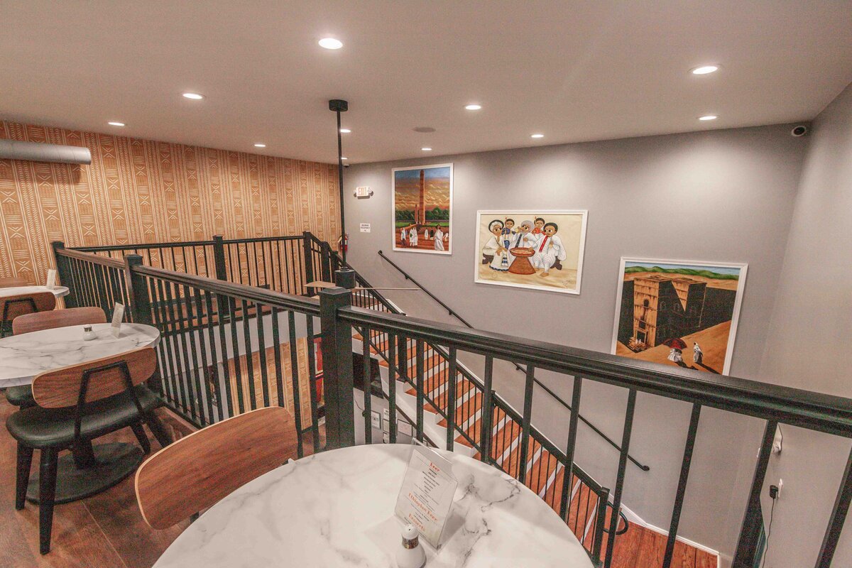 staircase with african wall art