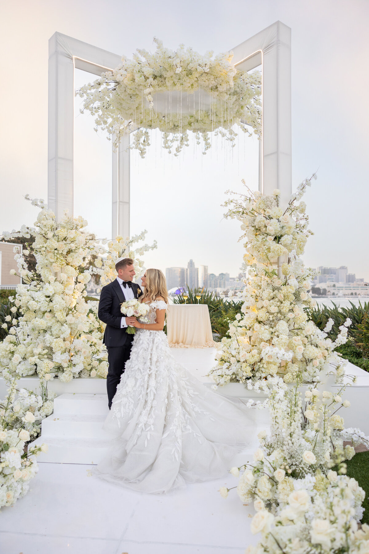 A bride and groom looking at each other lovingly