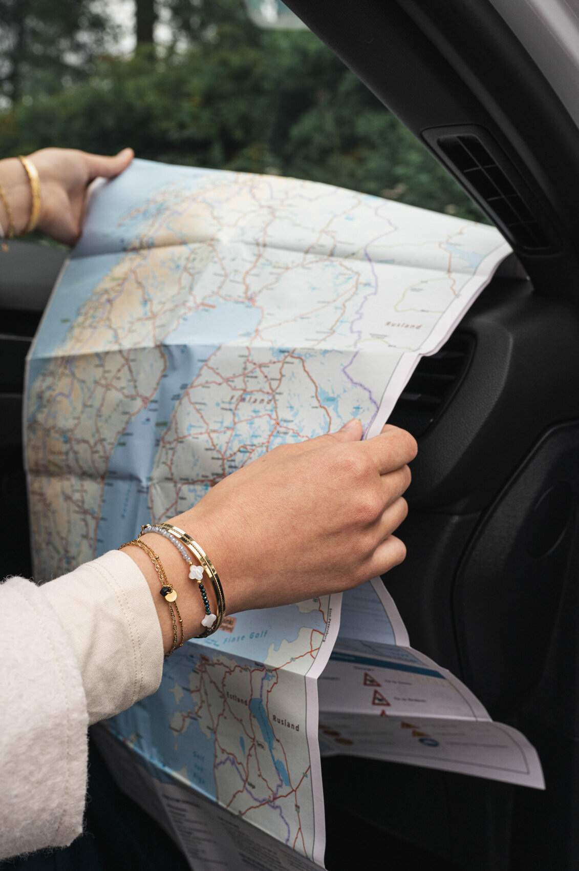 Close-up detail of jewellery photoshoot on the road theme