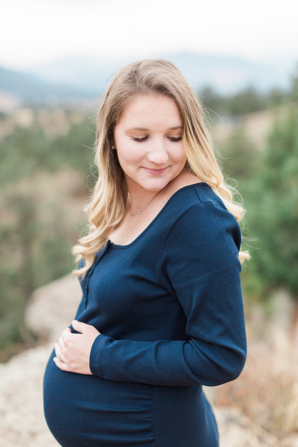 A pregnant mother with a mountain view in Denver