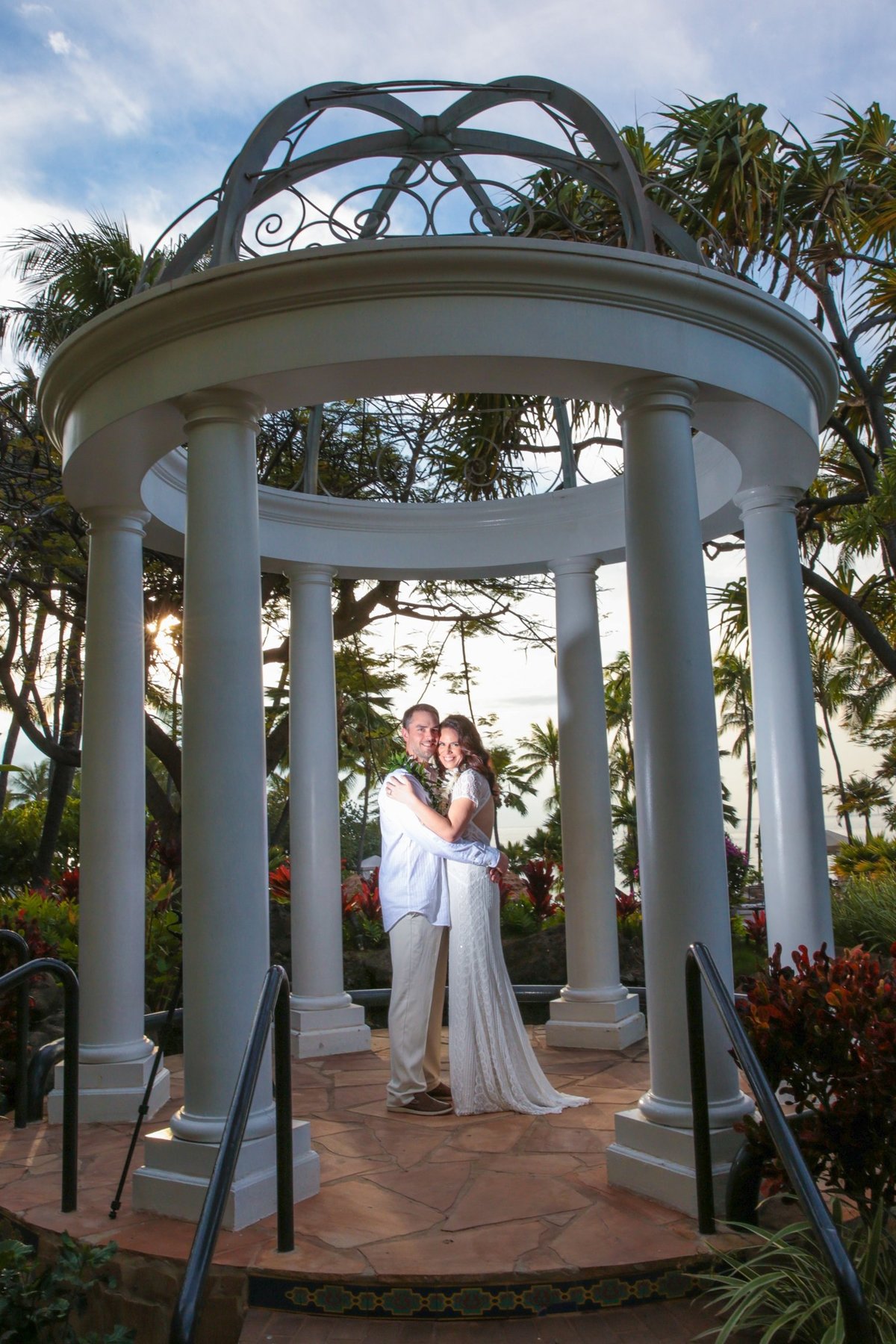 Maui Wedding Photography   at The Westin Maui Resort and Spa  with the bride and groom at sunset in the wedding gazebo