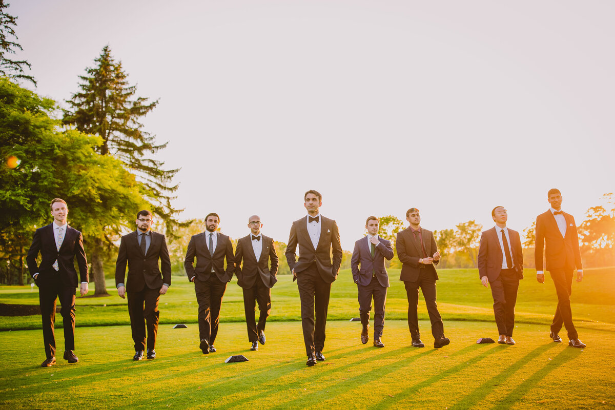 groomsmen walking on edgewood golf course in nj during indian wedding