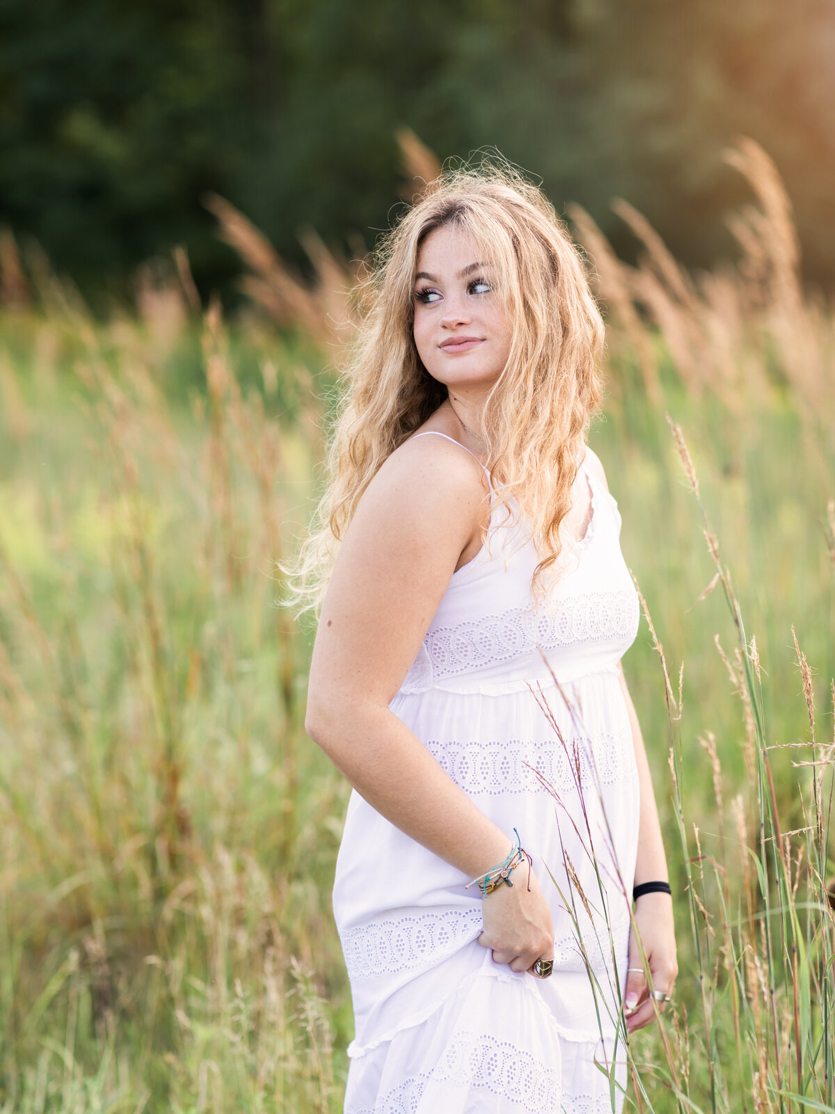 high school senior girl posing for senior portraits at westcreek reservation in parma ohio