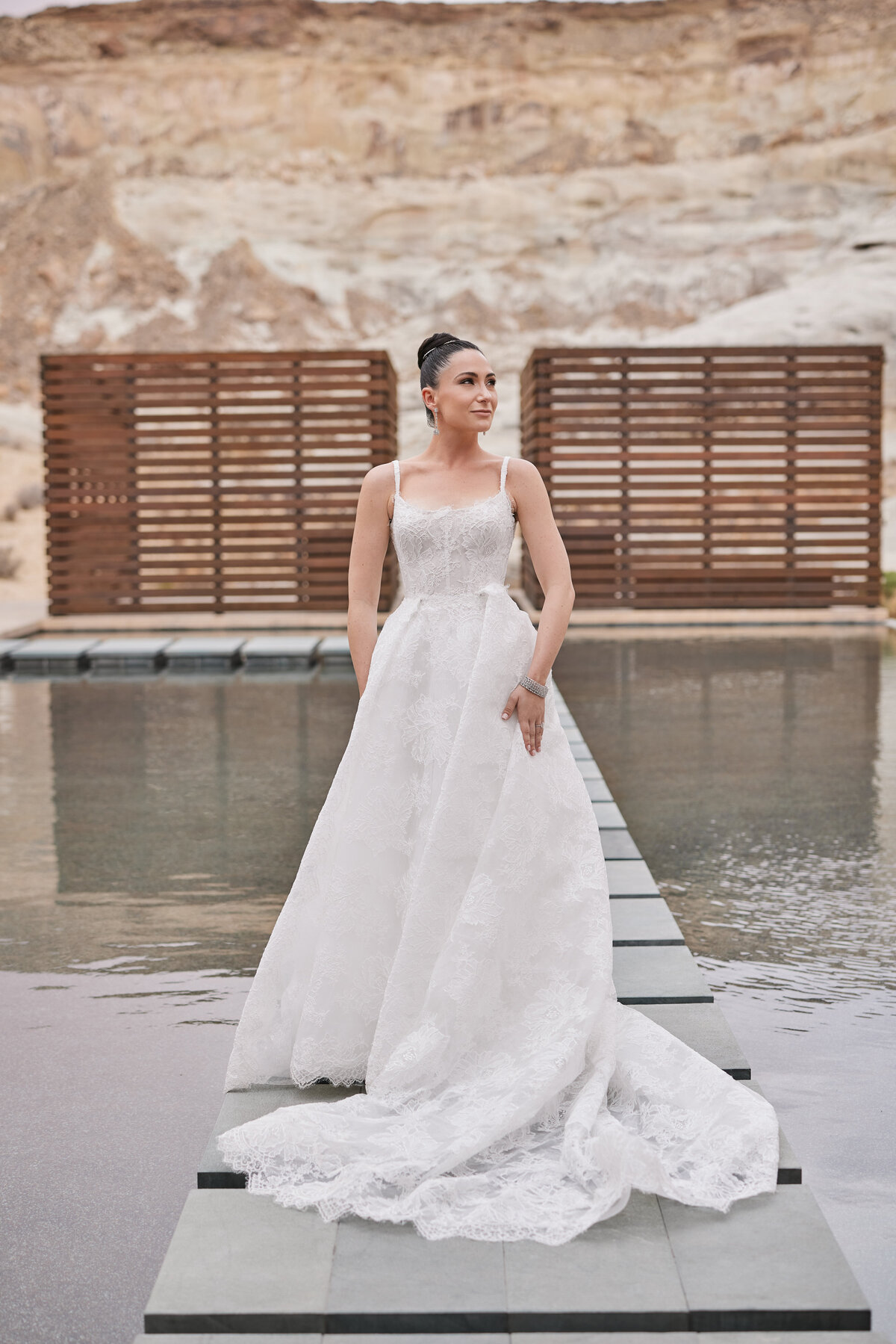 Bride standing at the mirror pool by the spa at amangiri