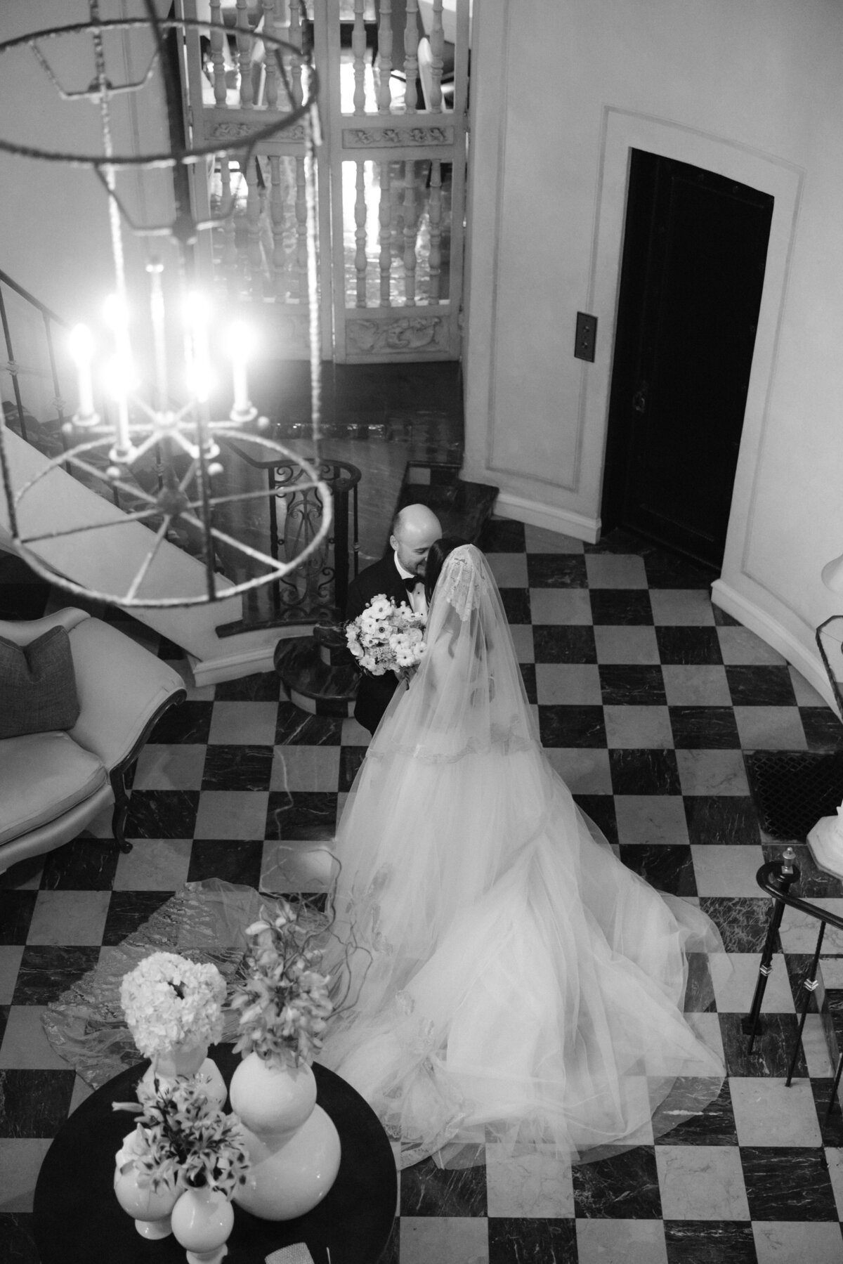 Black and white image of a bride and groom first look