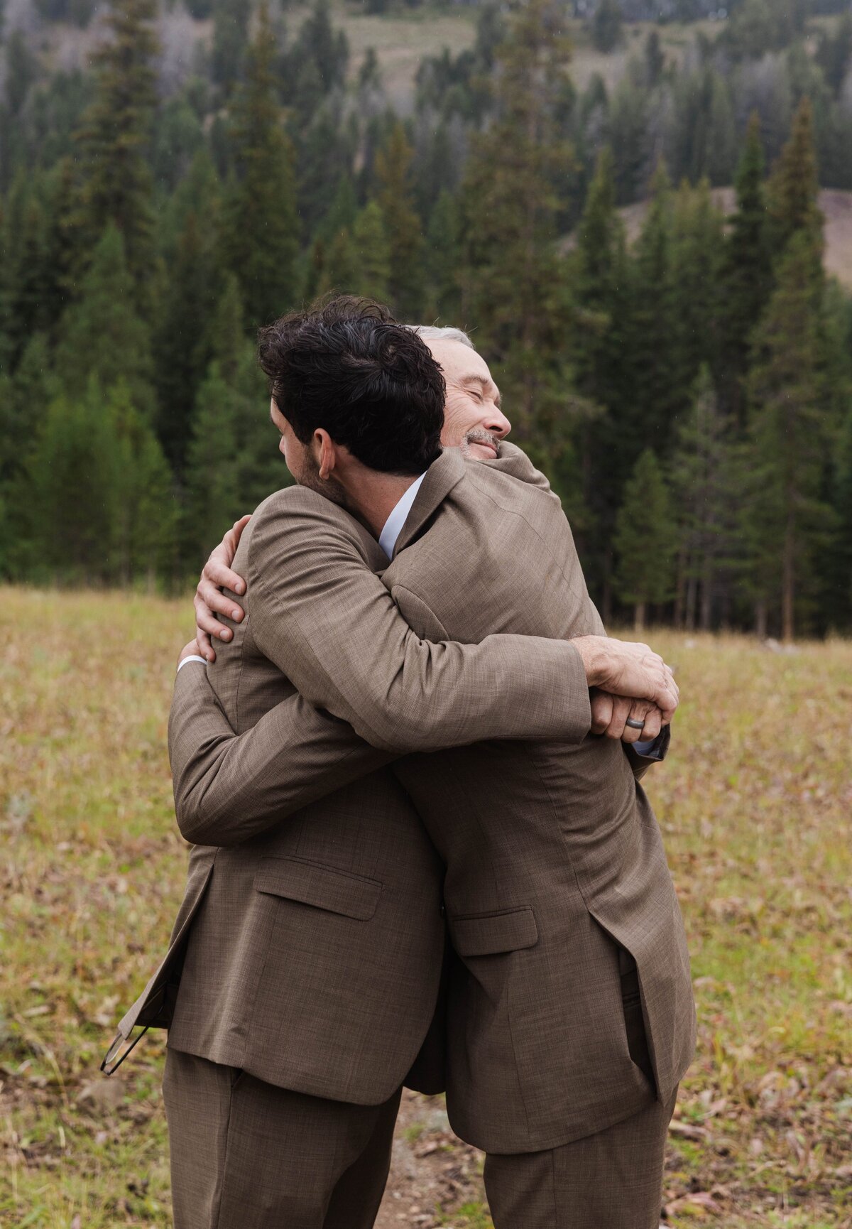 Groomsmen hugging each other at Idaho wedding