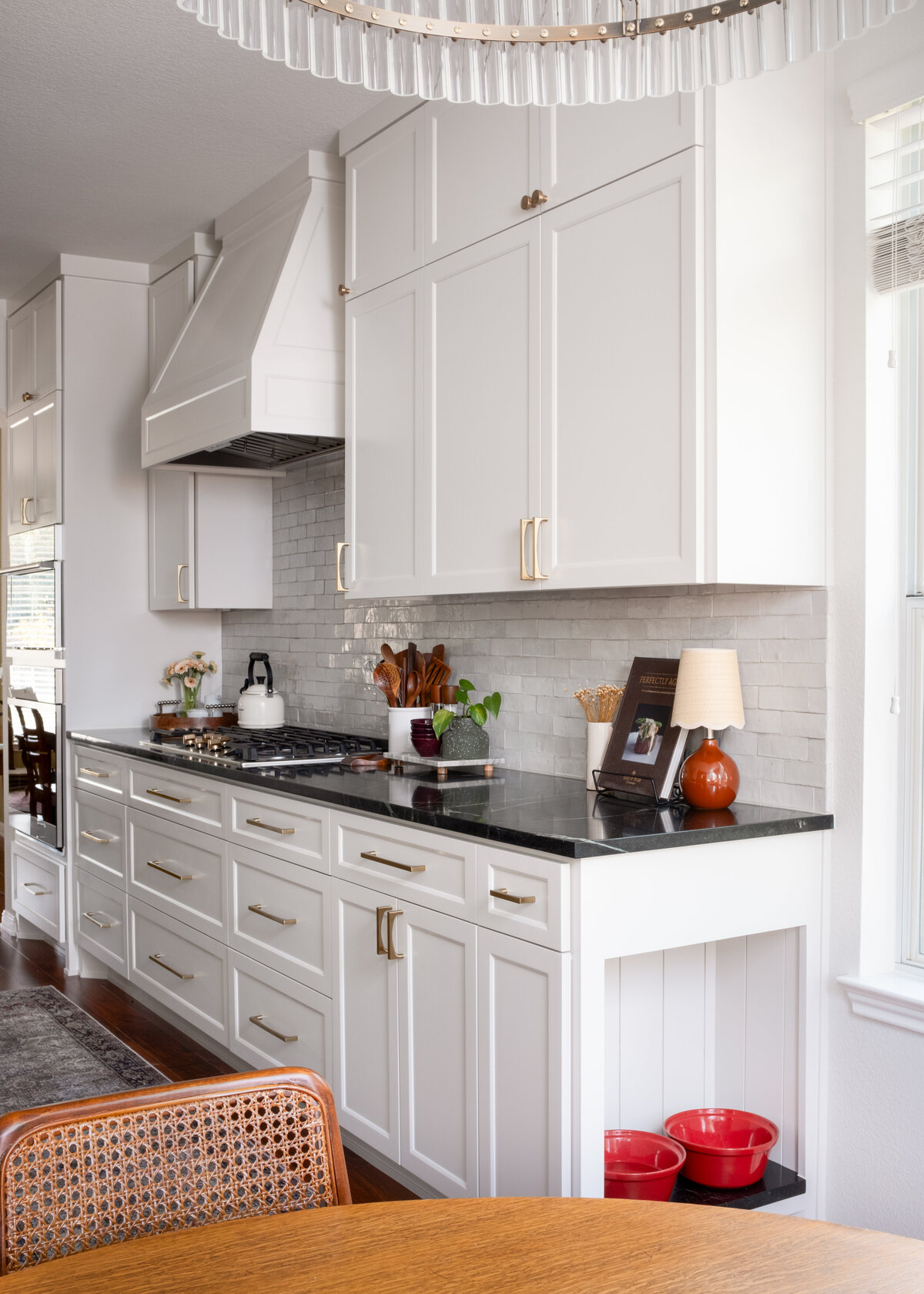 hello-home-austin-cream-kitchen-remodel-zellige-backsplash-contemporary-kitchen-dog-nook-tapered-vent-hood-soapstone-countertop-10