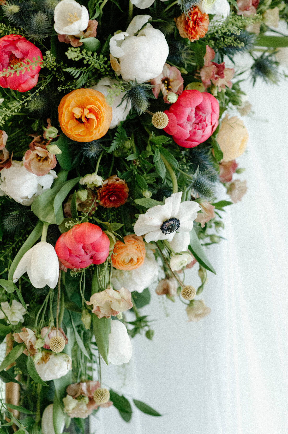 A close-up view of a brides colorful floral bouquet
