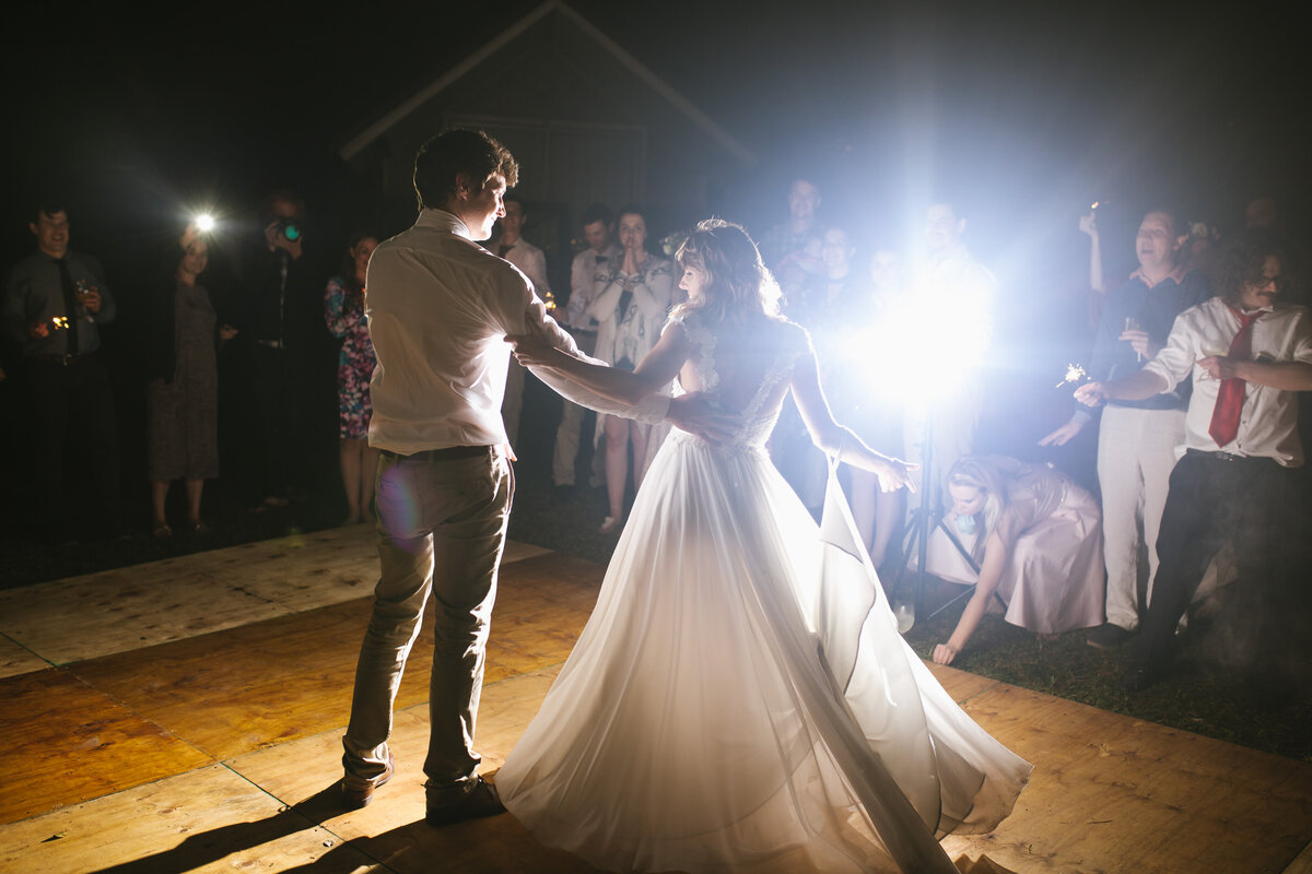 Bride and groom spin around in their first dance. 