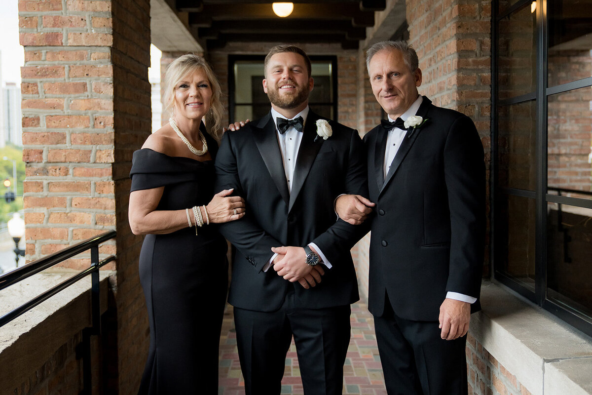 groom-with-parents-revel-motor-row-HBICWeddings